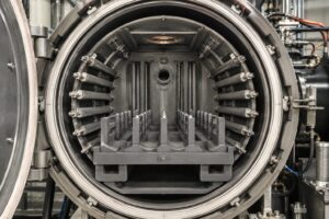Graphite components installed inside a vacuum furnace for high-temperature heat treatment applications.
